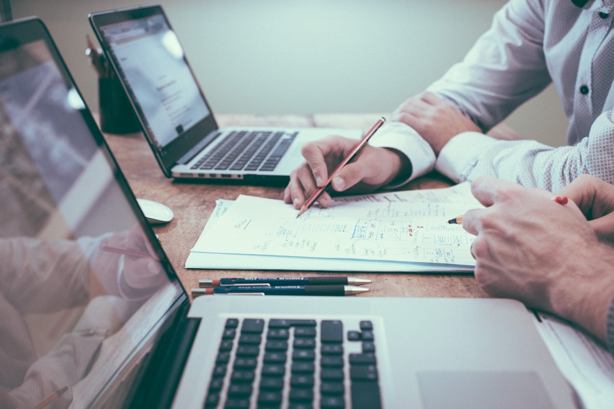 Advisor reviewing financial documents at a desk